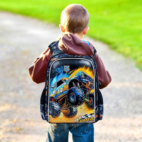 Kids backpack with blue monster-truck graphic on black background, worn by a child outdoors