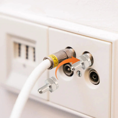F Type Terminator Caps 5 Pack With 75 Ohm Resistor For Unused Coax Ports on wall plate next to cable connector.