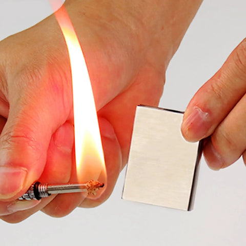 Hands using 5 Pack Waterproof Permanent Fire Starters For Camping And Emergencies, Durable Metal Flint Lighter Keychain Kit, No Fuel Needed