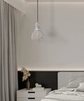 Bedroom view with Two Pack Pendant Lights With 6.5 Inch Hand Blown Seeded Glass And Brushed Nickel Finish above nightstand
