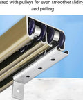 Heavy Duty Sliding Door Track Kit With Aluminum Alloy Double Track Rails And Roller Set For Wardrobe Barn And Garage Doors Smooth Operation Built To Last Easy Install And Supports Up To 120kg shown in close-up view with pulleys.