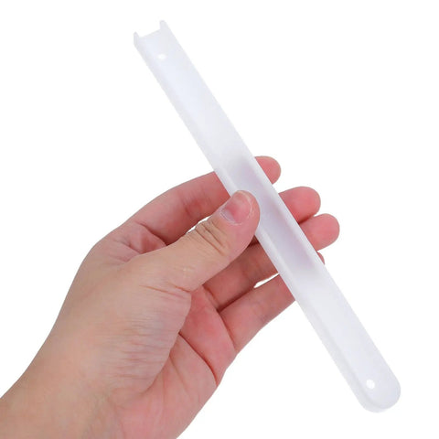 Two Piece White Plastic And Metal Drawer Slide Rail Kits With Heavy Duty Mounting Screws For Total No Sweat Diy Assembly And Smooth Kitchen Furniture Gliding, held in hand.