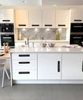 12 Pack Matte Black Cabinet Handles And Drawer Pulls Aluminum 5 Inch Hole Center installed on modern white cabinets