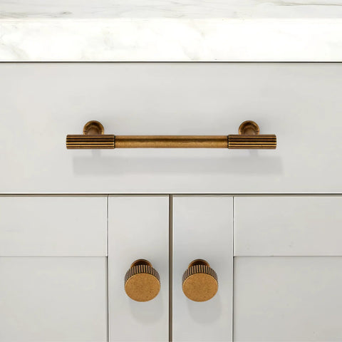 Antique Brass Cabinet Knobs 10 Pack 28mm Round Single Hole Drawer Pulls For Kitchen Cabinets And Furniture installed on white cabinet