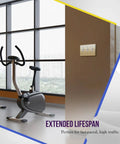 Gym with Toggle Light Switch Wall Plate, Metal 3-Gang 4.50 x 6.38 Inches, Brass Gold Finish, on brown wall next to exercise bikes.