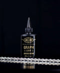 Front view of Graphite Bicycle Lubricant With Submicron Graphite And Ceramic Additives Wax Formula 120 Ml bottle with chain