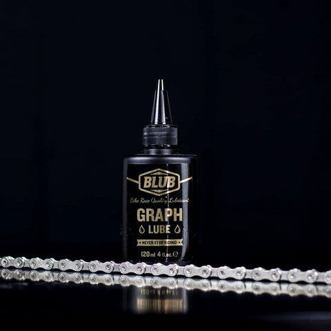 Front view of Graphite Bicycle Lubricant With Submicron Graphite And Ceramic Additives Wax Formula 120 Ml bottle with chain