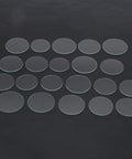 Watch Glass Replacement Kit 21 Pcs Flat Mineral Crystal Lenses 35mm To 45mm 1.2mm Thick displayed on black surface