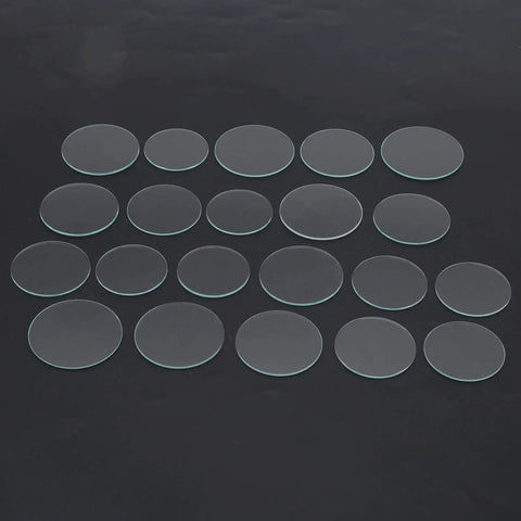 Watch Glass Replacement Kit 21 Pcs Flat Mineral Crystal Lenses 35mm To 45mm 1.2mm Thick displayed on black surface