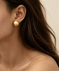 Bold Gold Round Earrings For Women Featuring A Chunky Wide Half Ball Design Lightweight Studs For Everyday Wear Dope Party Ready Glam Vibe Trendy Circle Hoop Look Essential Accessory For Chic Street Style, gold stud earring