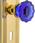 Retro Vibe Deco Plate With Keyhole Crystal Cobalt Glass Door Knob And Privacy Lockset Two And Three Eighths Inch Backset Unlacquered Brass