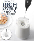 Handheld Frother Battery Powered Foam Maker Wand With Stainless Steel Whisk creating froth in a glass of milk