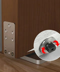 Heavy Duty Hidden Door Hinge With Hydraulic Self Closing Buffer And 90 Degree Positioning For Wood Doors with visible silver mechanism and wood frame.