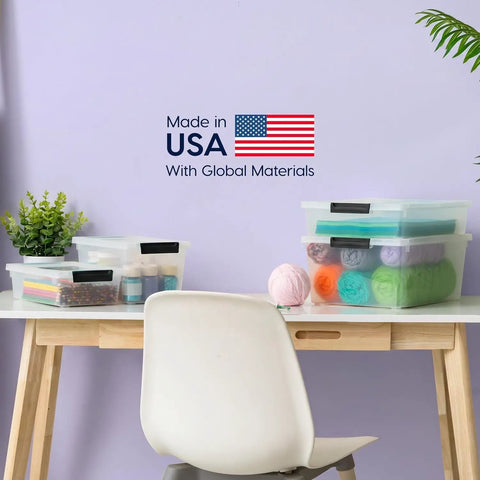 Heavy Duty Clear Plastic Storage Bins With Lids 6 Pack 4 Quart Polypropylene on a desk with craft supplies and yarn balls.