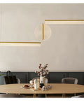 Modern Minimalist Three-Stage Creative Pendant Light Dining Table Indoor Living Room Bar Golden/Black LED Light in a stylish dining setup.