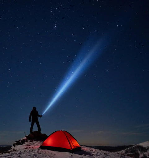 Person using ML50LX 2-Cell C LED Flashlight With Beast-Mode Beam And Adjustable Focus beside red tent under starry sky
