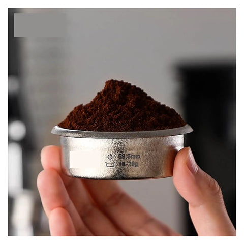 Premium Titanium Portafilter Basket 58.5mm holds 18 to 20 grams with ground coffee, ideal for espresso preparation.