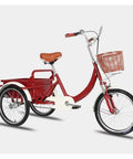 Red adult tricycle with back cabin cargo, PU leather backrest seat, front fork shock absorber, pneumatic spoke wheels.