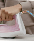 Person using steam iron with High Pressure Steam Hose Tube For Professional Steam Irons, High Temperature Resistant, sky-blue