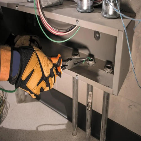 Insulated Long Nose Side Cutter Pliers, 1000V Rated and VDE Certified in use by electrician inside junction box