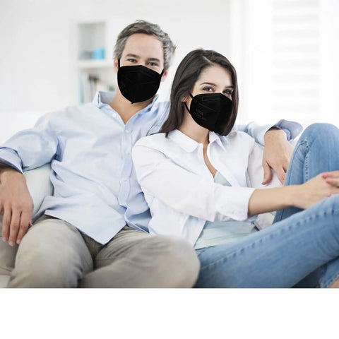 Couple wearing Kn95 Face Masks 50 Pack Individually Wrapped Five Layer Protective Respirators For Adults Men Women Indoor Outdoor Use Black