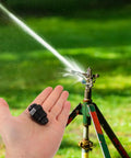 20 Pack Drip Irrigation Air Release Valve Vacuum Relief Valve For Automated Farm Irrigation held near a sprinkler