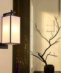 Knockout Indoor Rectangular Wall Light Featuring Handmade Linen Shade And Corrosion Resistant Iron Body giving soft light in stylish indoor setting.