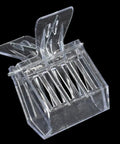 Transparent plastic bee queen cage catcher clip for one hand use, part of a 12 pack beekeeping kit, shown against black background.