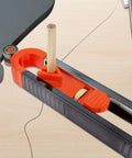 Killer Precision Metal Contour Gauge Scribe Tool With A Tight Lock Mechanism and Twin Pencils on a wooden surface, showing the pencil holder.