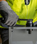 Worker using Optimized Knockout Punch Set For Ten Gauge Mild Steel With Three Quarters Inch Die Makes Wrenching A Breeze