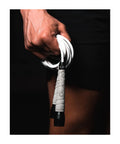Close-up of hand holding Tangle-Free Boxing Jump Rope, Fifteen Percent Heavier Than PVC, with adjustable length and grip tapes.