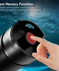 Close-up of thumb pressing power button on Beast Mode 3000 Lumen Dive Flashlight For Underwater Exploration Rechargeable Scuba Light.