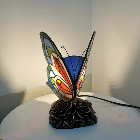 Butterfly Tiffany Style Stained Glass Accent Table Lamp Night Light Multicolored Warm White LED Included In Line Switch 8 Inches Wide 9 Inches Tall Perfect for Living Room Bedroom Decor on a table.