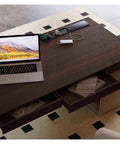 Top Shelf Standing Desk With Sleek Smoky Matte Paint Boss Ready Computer Workstation showing laptop on solid wood surface with drawers and charging station.