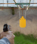 Person aiming at AR500 Steel Target With Gong Mounting Kit And Neon Color Hostage Target for outdoor range shooting