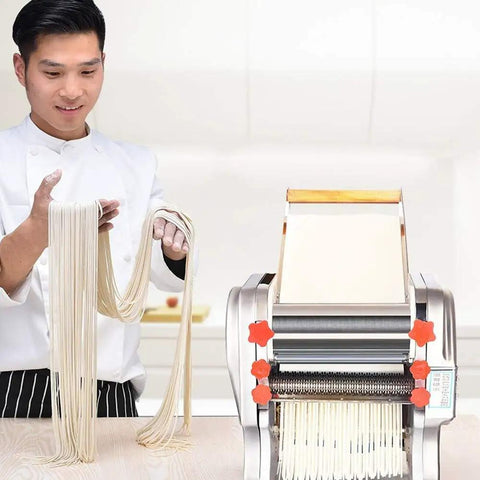Chef showing fresh noodles made with Compact Automatic Electric Pasta Maker For Fresh Homemade Noodles Stainless Steel Kitchen Press.