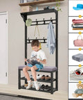 Child sitting on cushioned seat of Industrial Coat Rack Shoe Bench With 8 Hooks Freestanding Garment Hanger And Shelf Hall Tree