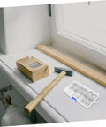 Stainless Steel External Circlip Assortment Kit E Type Retaining Rings displayed on a windowsill with tools for machinery repair.