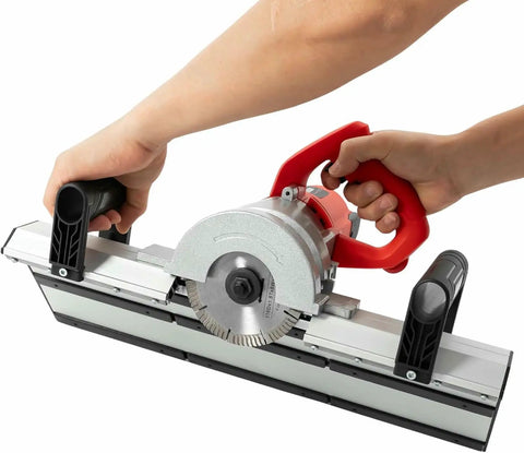 Professional Electric Tile Chamfering Machine With Solid Aluminum Base For Dead On 45 Degree Ceramic Edges Using Quick Swap Blades. User holding machine.