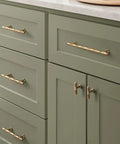 Champagne Bronze Cabinet Pulls 5 Inch Hole Center 10 Pack No Brainer Durable Hammered Sleek Handles installed on green kitchen drawers