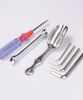 Set of tools including a screwdriver, spanner, scoop, and hex keys on white background.