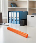 Adjustable Telescoping Poster Tube 52 to 95 cm for Posters, Blueprints and Artwork on an office desk.
