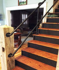 Straight Up Industrial Pipe Stair Handrail Featuring A Rock Solid Non Slip Grip Built Tough For Hallways And Lofts Delivering Daily Safety For Every Home Setup on wooden staircase with black steps.