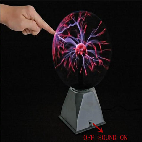 Lit Glass Plasma Ball Light Toy With Touch And Sound Activation 4 Inch Electrostatic Lightning Sphere glowing to a fingertip touch