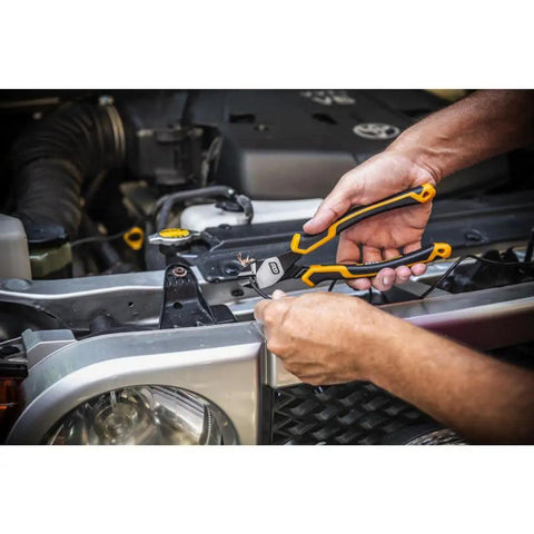 Person using Pitbull Dual Material 4 Piece Plier Set With High Leverage Joint Beastly Grip And Cross Hatched Jaw Teeth For Superior Cutting Gripping And Pulling Power 82203C on car engine