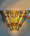 Tiffany Style Wall Sconce With Stained Glass Shade, Mission Inspired Lamp For Living Room Or Bedroom, 1 Light Fixture Delivers Cozy Warm Glow And Classic Vintage Vibe, glowing against wall.