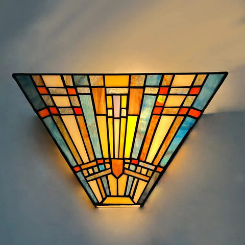 Tiffany Style Wall Sconce With Stained Glass Shade, Mission Inspired Lamp For Living Room Or Bedroom, 1 Light Fixture Delivers Cozy Warm Glow And Classic Vintage Vibe, glowing against wall.