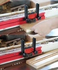 Heavy Duty Aluminum Alloy Table Saw Feeding Roller Guide With Ball Bearings For T Track Woodworking Fences shown in use with wood being cut.