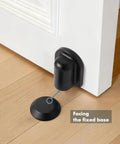 Matte Black Magnetic Door Stopper Holds Interior Doors Firmly Open Heavy Duty Floor Mounted Catch shown installed on hardwood floor.