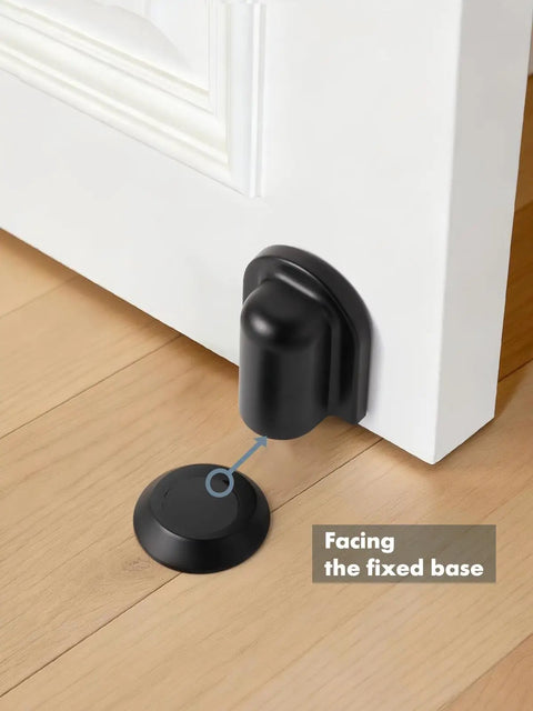 Matte Black Magnetic Door Stopper Holds Interior Doors Firmly Open Heavy Duty Floor Mounted Catch shown installed on hardwood floor.